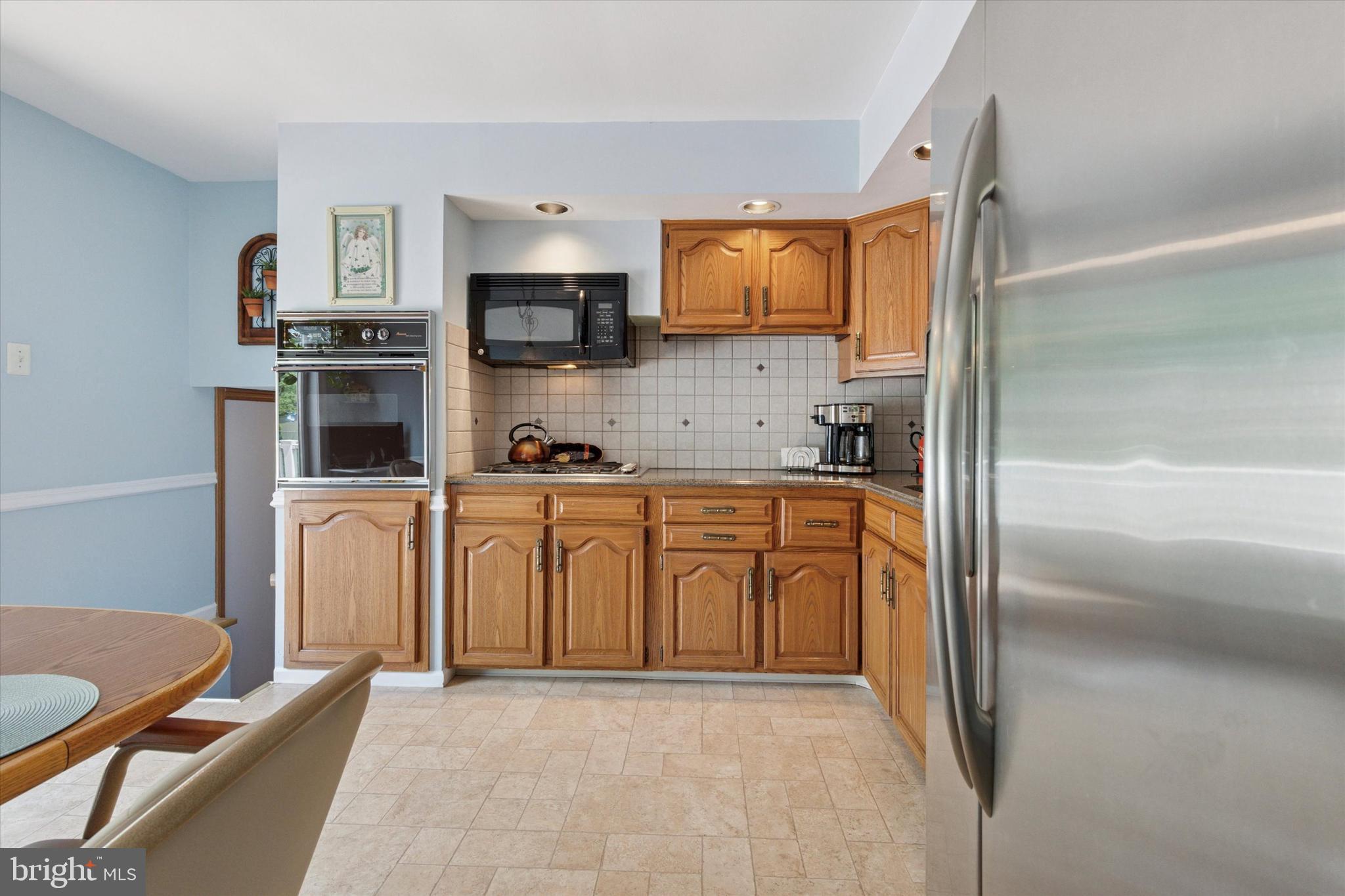 315 Waverly Road Southampton, PA 18966 - Photo 10 of 24 a kitchen with white cabinets and refrigerator