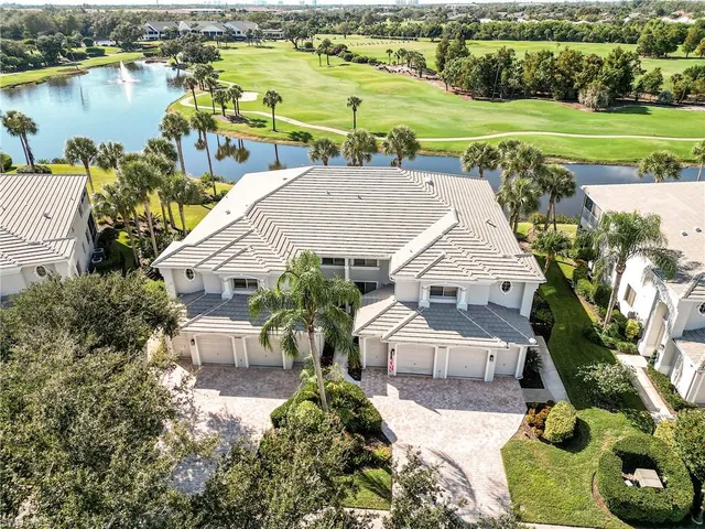 an aerial view of a house with a ocean view