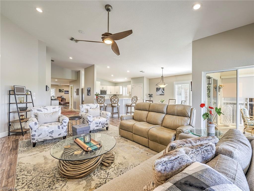 8460 Southbridge Drive, Unit 2 Estero, FL 33967 - Photo 12 of 42 a living room with furniture and kitchen view
