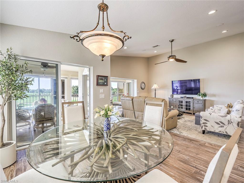 8460 Southbridge Drive, Unit 2 Estero, FL 33967 - Photo 13 of 42 a living room with dining room and couches