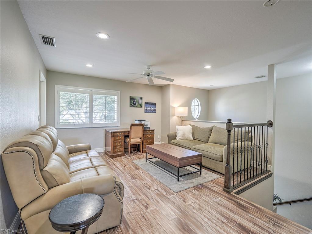 8460 Southbridge Drive, Unit 2 Estero, FL 33967 - Photo 20 of 42 a living room with furniture and a window