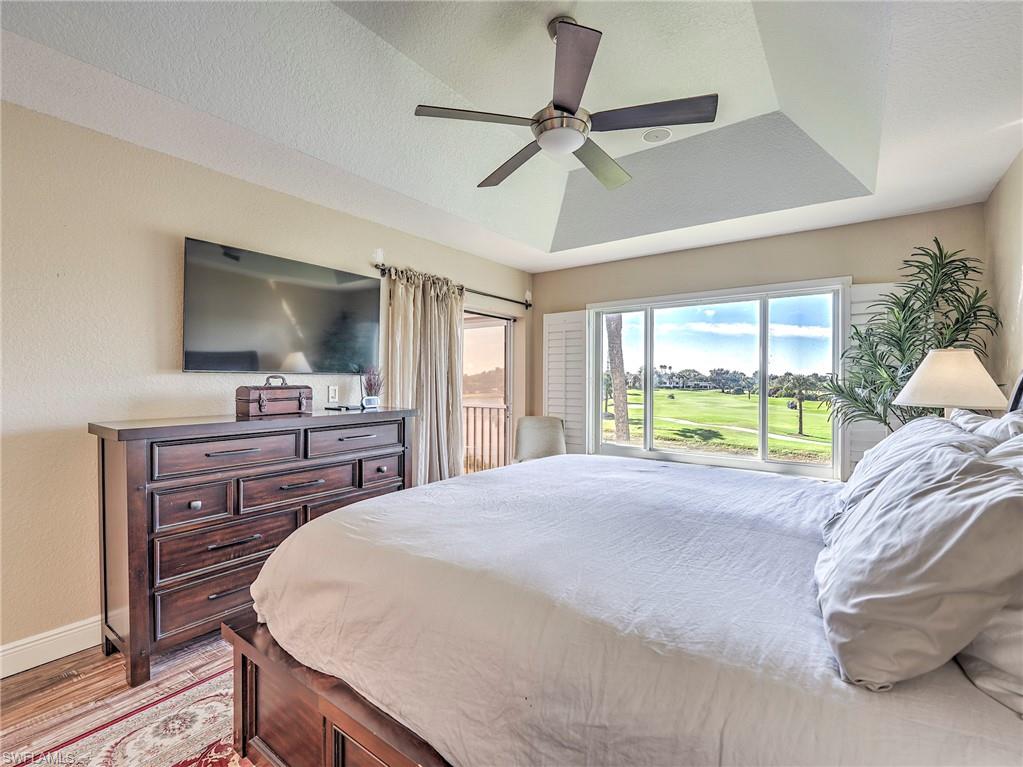 8460 Southbridge Drive, Unit 2 Estero, FL 33967 - Photo 25 of 42 a bed room with a bed and a television