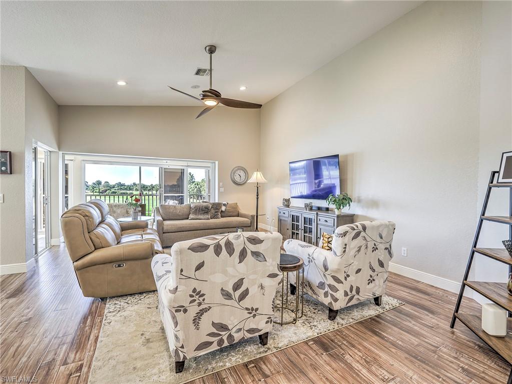 8460 Southbridge Drive, Unit 2 Estero, FL 33967 - Photo 10 of 42 a living room with furniture a rug and a flat screen tv