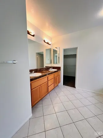 a kitchen with stainless steel appliances a sink and cabinets