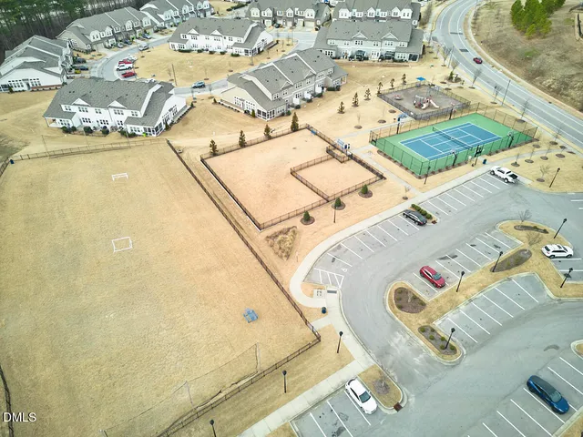 a green field with white walls