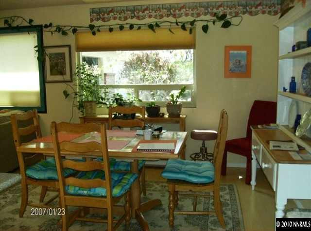 1430 Clough Road Reno, NV 89509 - Photo 3 of 9 a room with furniture and a large window
