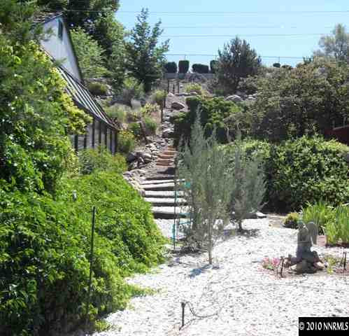 1430 Clough Road Reno, NV 89509 - Photo 8 of 9 a view of a house with a yard