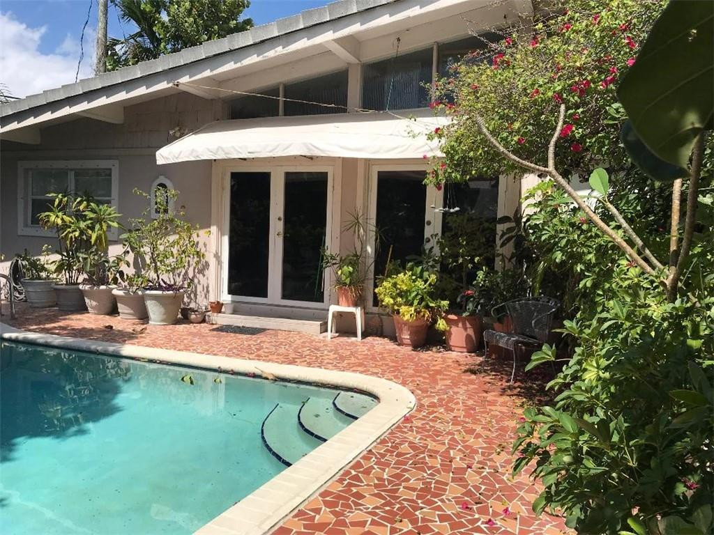 2713 Northeast 30th Avenue Lighthouse Point, FL 33064 - Photo 19 of 22 a view of a house with swimming pool