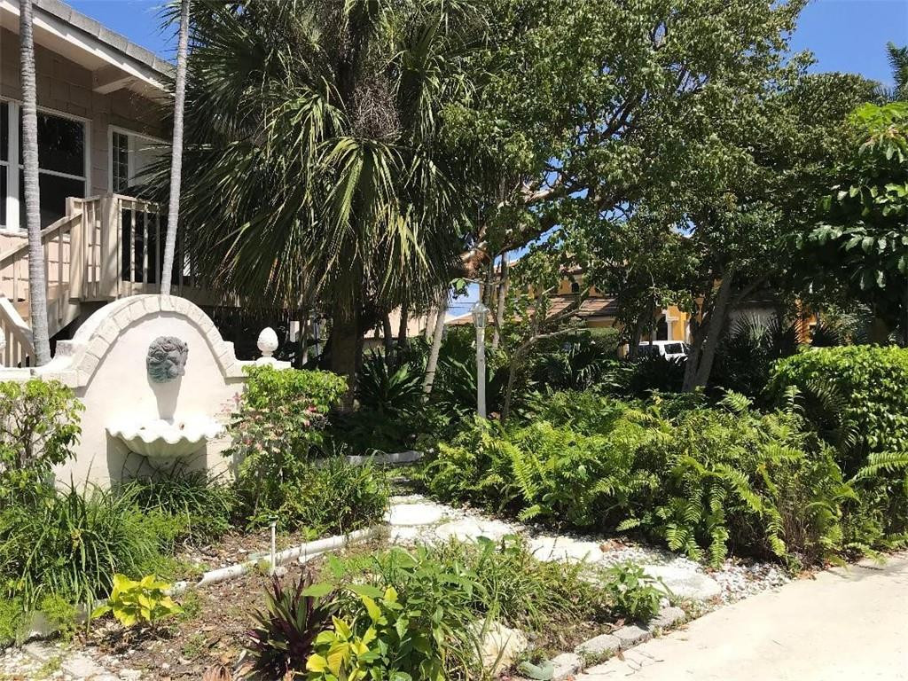 2713 Northeast 30th Avenue Lighthouse Point, FL 33064 - Photo 20 of 22 a view of a garden with plants