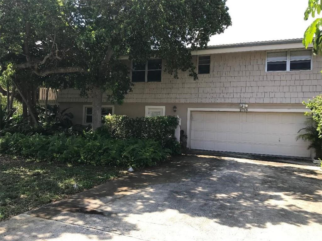 2713 Northeast 30th Avenue Lighthouse Point, FL 33064 - Photo 21 of 22 a view of a house with a yard