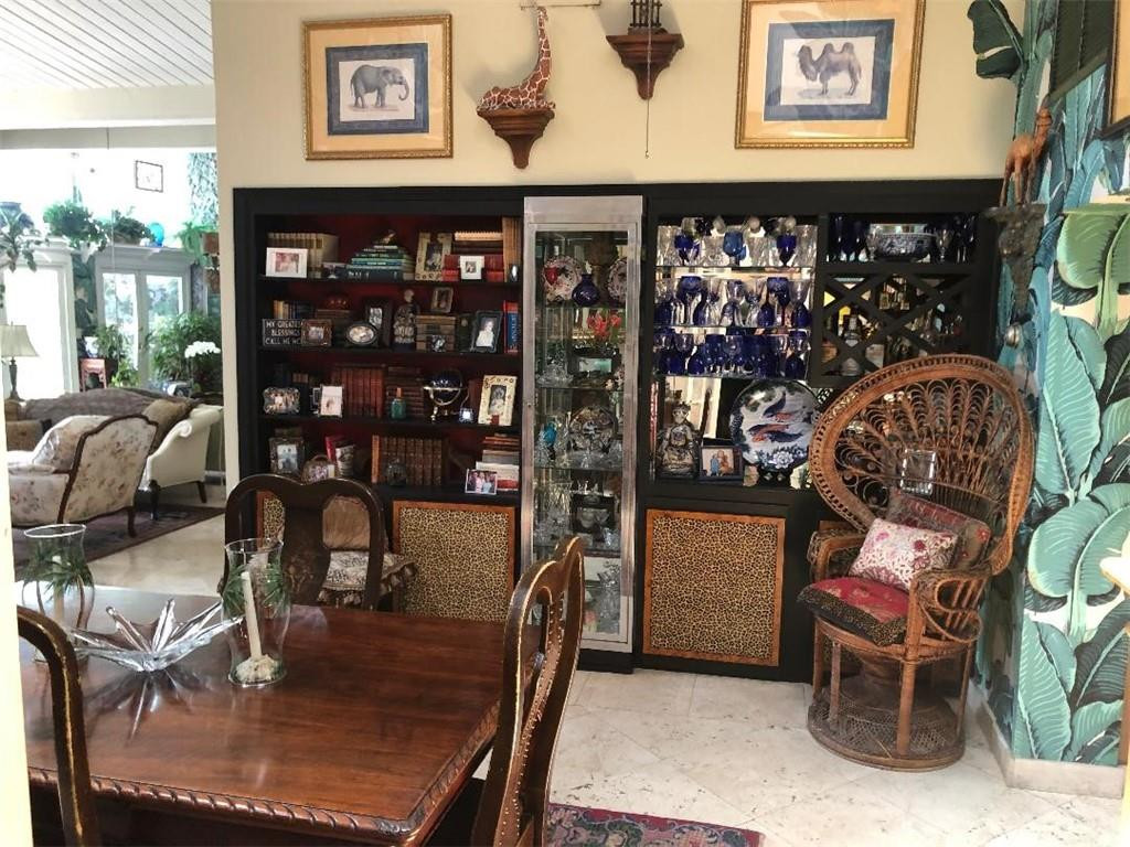 2713 Northeast 30th Avenue Lighthouse Point, FL 33064 - Photo 8 of 22 a living room with fireplace furniture and a potted plant