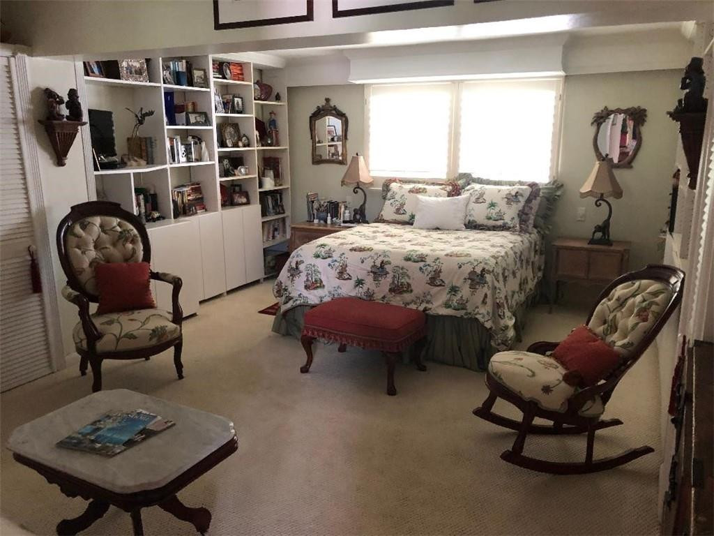 2713 Northeast 30th Avenue Lighthouse Point, FL 33064 - Photo 9 of 22 a bedroom with furniture and a large window