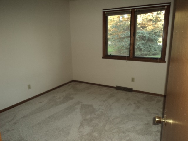 12236 Tresemer Road Roscoe, IL 61073 - Photo 3 of 9 an empty room with a window