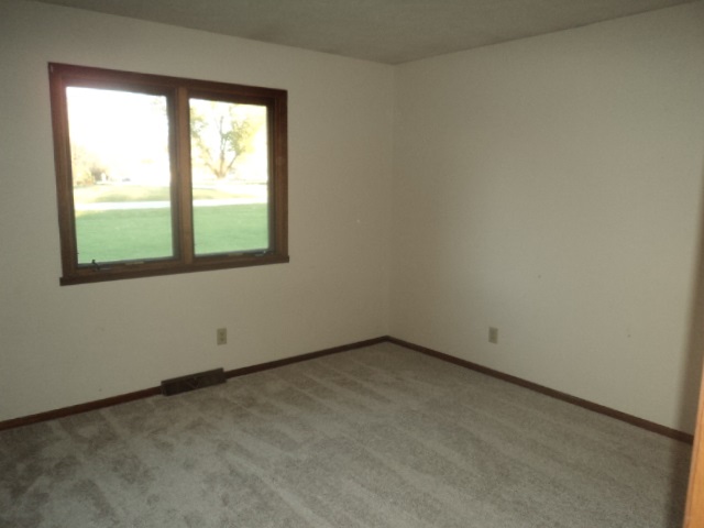 12236 Tresemer Road Roscoe, IL 61073 - Photo 4 of 9 an empty room with a window