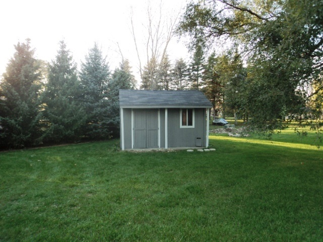 12236 Tresemer Road Roscoe, IL 61073 - Photo 7 of 9 a view of a house with a yard