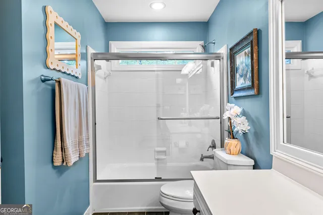 a picture of a room with a white wall and a painting