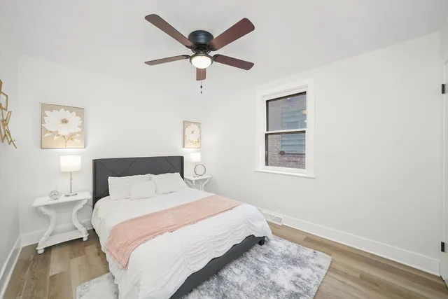 a bedroom with a large bed and a window