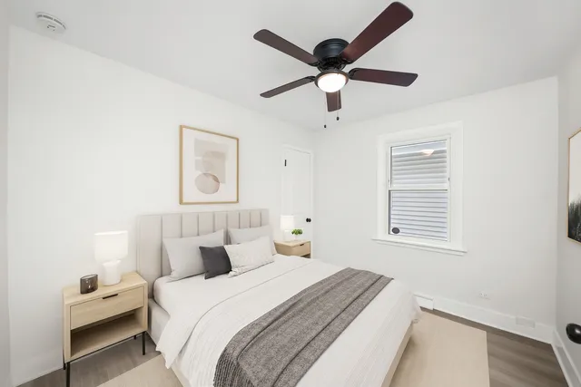 a bedroom with a large bed and a window