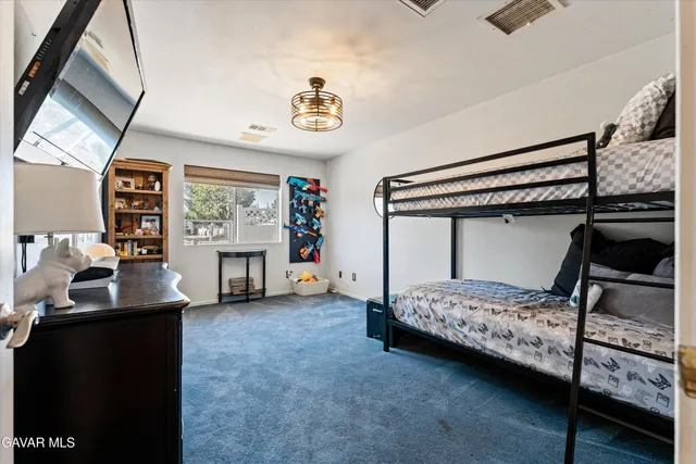 a bathroom with a bathtub sink and mirror
