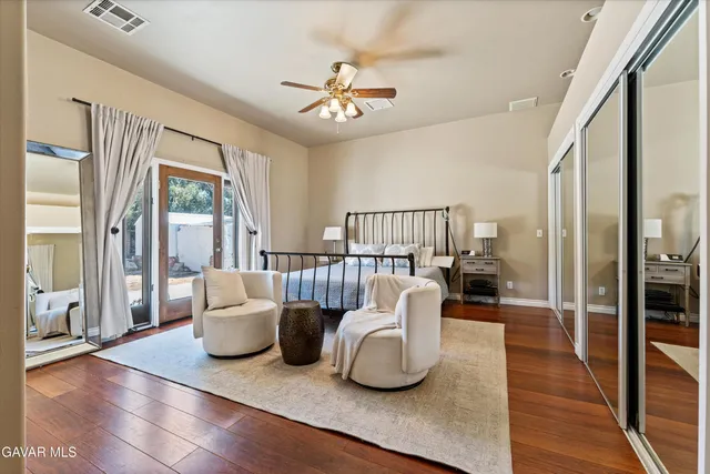 a living room with furniture a rug and a window