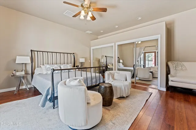 a living room with furniture and a open kitchen view