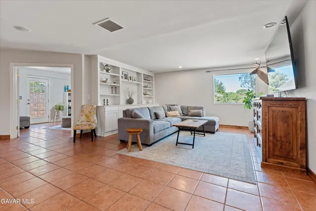 a kitchen with stainless steel appliances granite countertop a stove top oven sink and cabinets