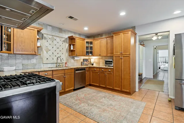 a view of a house with a snow in the yard