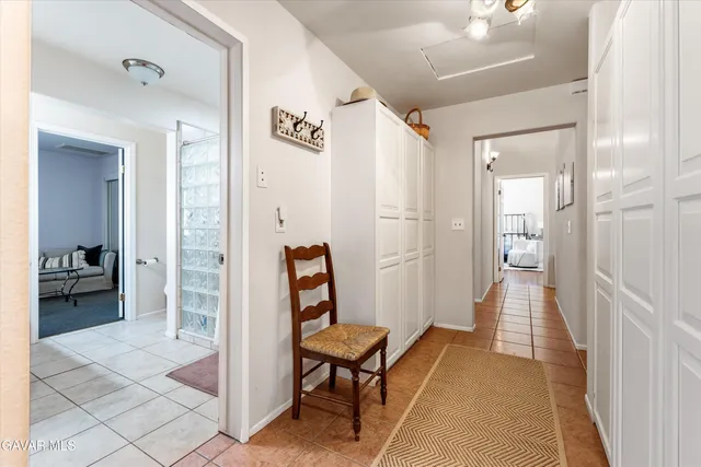 a bedroom with a bed and a television