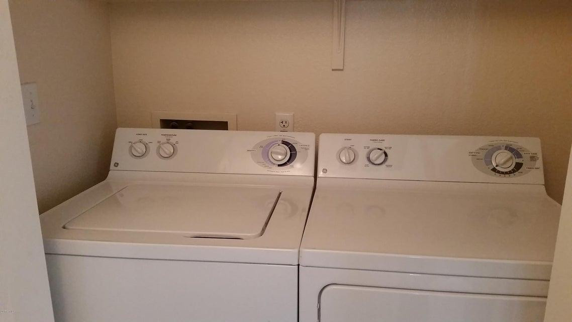 18416 North Cave Creek Road, Unit 2057 Phoenix, AZ 85032 - Photo 2 of 11 a close up view of washer and dryer with washer and dryer