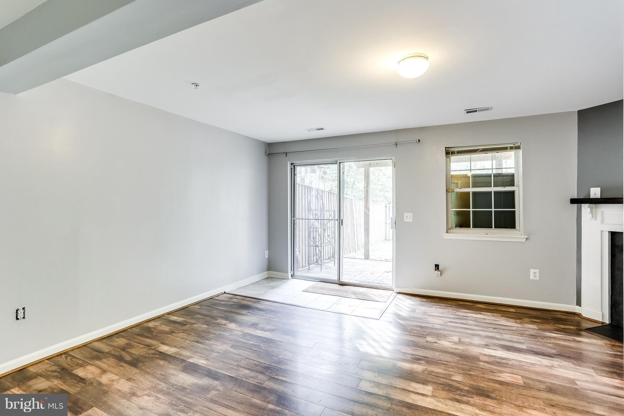 6514 Ridgeborne Drive Baltimore, MD 21237 - Photo 23 of 31 Lower Level Family Room with Sliders to Patio