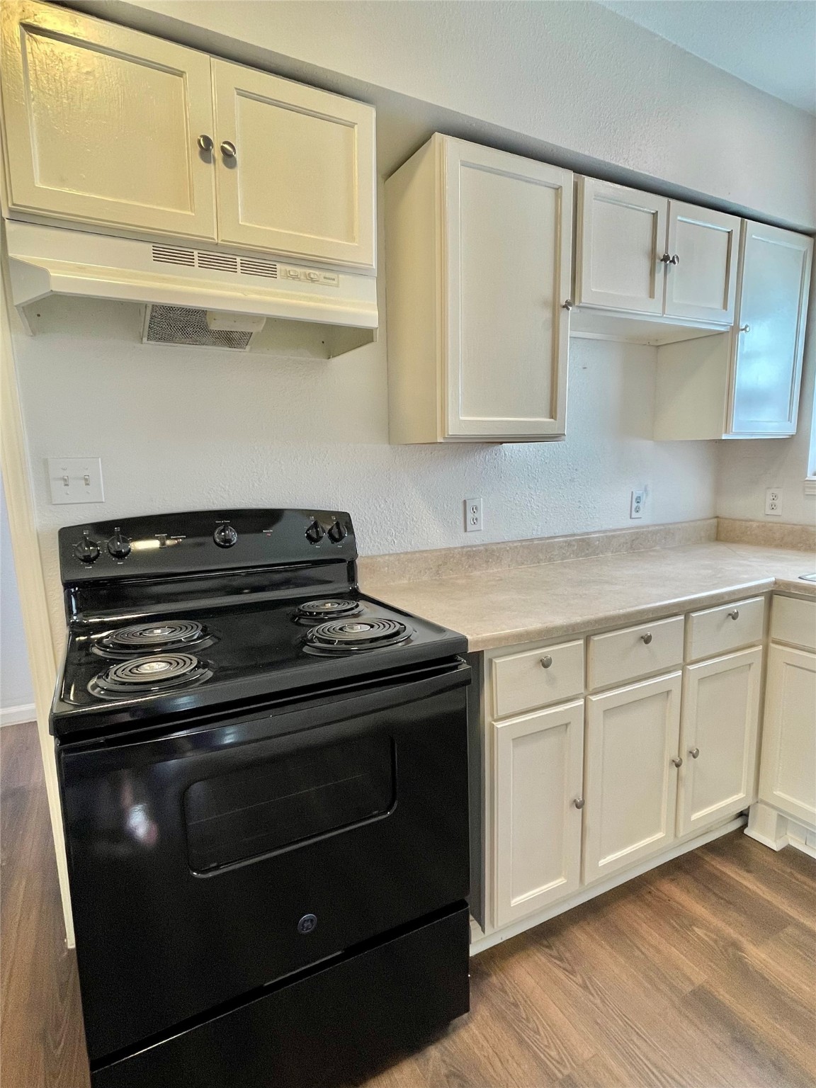 1755 West 6th Street Freeport, TX 77541 - Photo 14 of 19 a stove top oven sitting inside of a kitchen