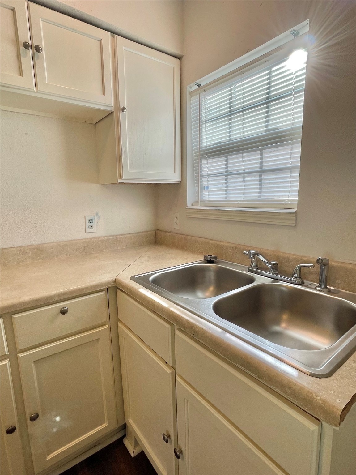 1755 West 6th Street Freeport, TX 77541 - Photo 15 of 19 a kitchen with white cabinets and a sink