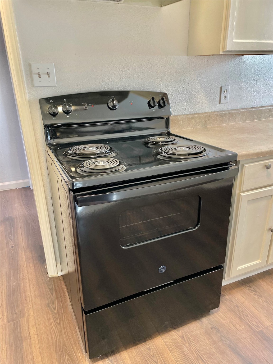 1755 West 6th Street Freeport, TX 77541 - Photo 16 of 19 a stove top oven sitting inside of a kitchen