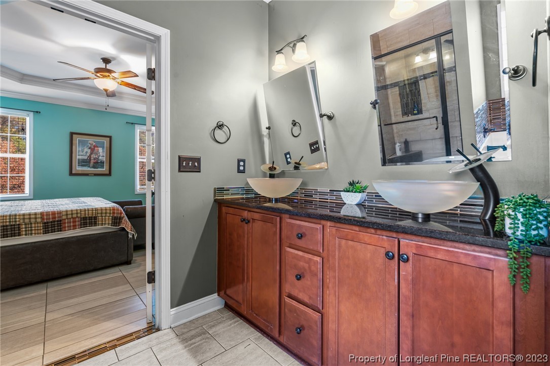 42 Annapolis Road Cameron, NC 28326 - Photo 20 of 43 a bathroom with a sink and a mirror