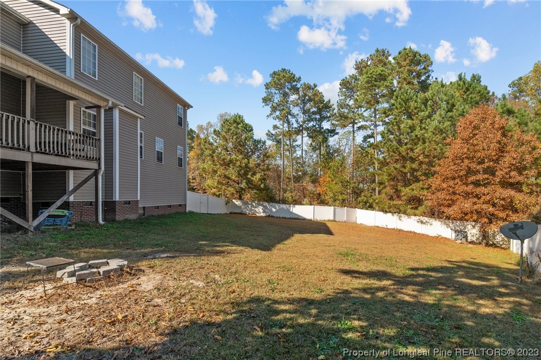 42 Annapolis Road Cameron, NC 28326 - Photo 7 of 43 a view of a yard with an outdoor space
