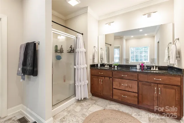 a spacious bathroom with a sink and a mirror