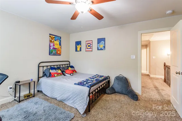 a bedroom with a bed and dresser