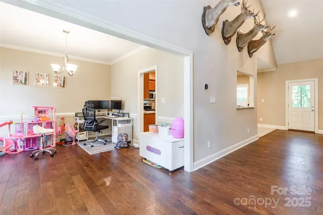 a bedroom with furniture and a chandelier