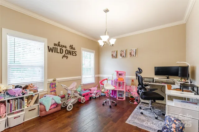 a bedroom with furniture and a chandelier
