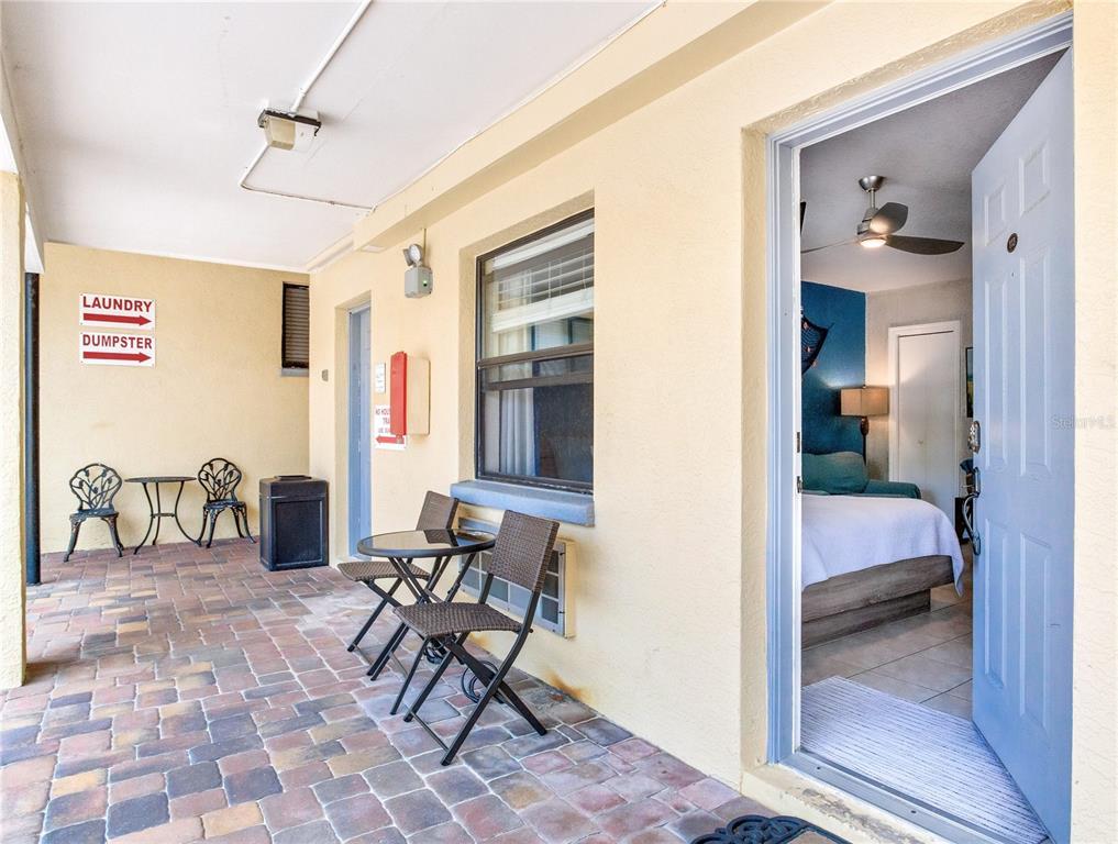 16333 Gulf Boulevard, Unit 113 Redington Beach, FL 33708 - Photo 5 of 40 a view of a livingroom with furniture and front door