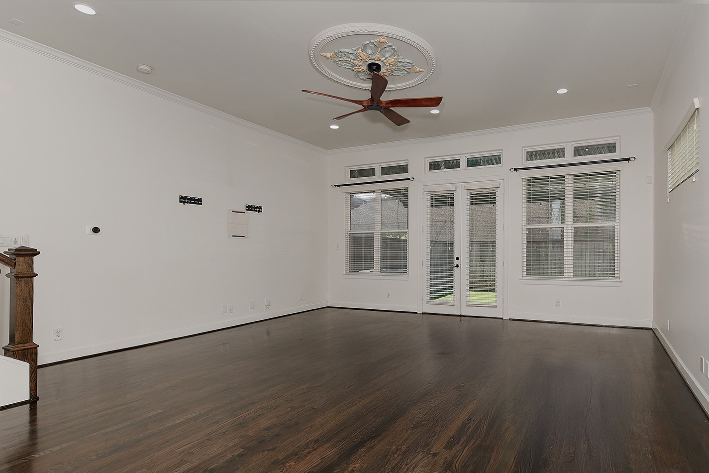 5233 Cornish Street, Unit C Houston, TX 77007 - Photo 8 of 28 a view of a livingroom with wooden floor and a ceiling fan