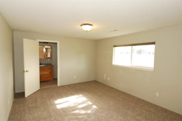 4782 Lower River Road Grants Pass, OR 97526 - Photo 15 of 28 an empty room with closet and windows