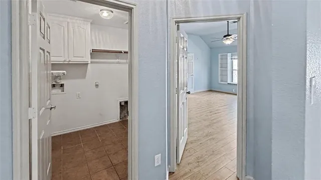 a view of walk in closet with white walls
