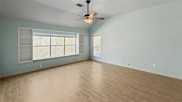 a bathroom with a sink vanity granite and a mirror