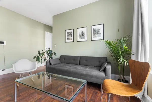 a bedroom with a bed and a couch