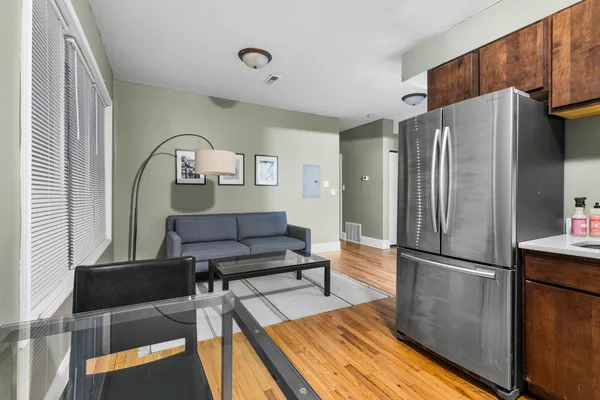 a kitchen with stainless steel appliances granite countertop a stove refrigerator sink and microwave