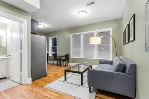 a living room with lots of furniture and a flat screen tv