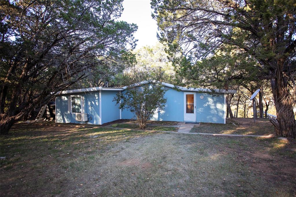 9051 Lacy Road Graford, TX 76449 - Photo 3 of 23 a view of a house with a yard