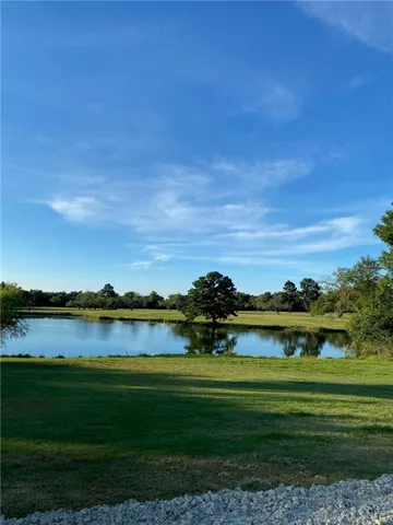 a view of a lake with a big yard