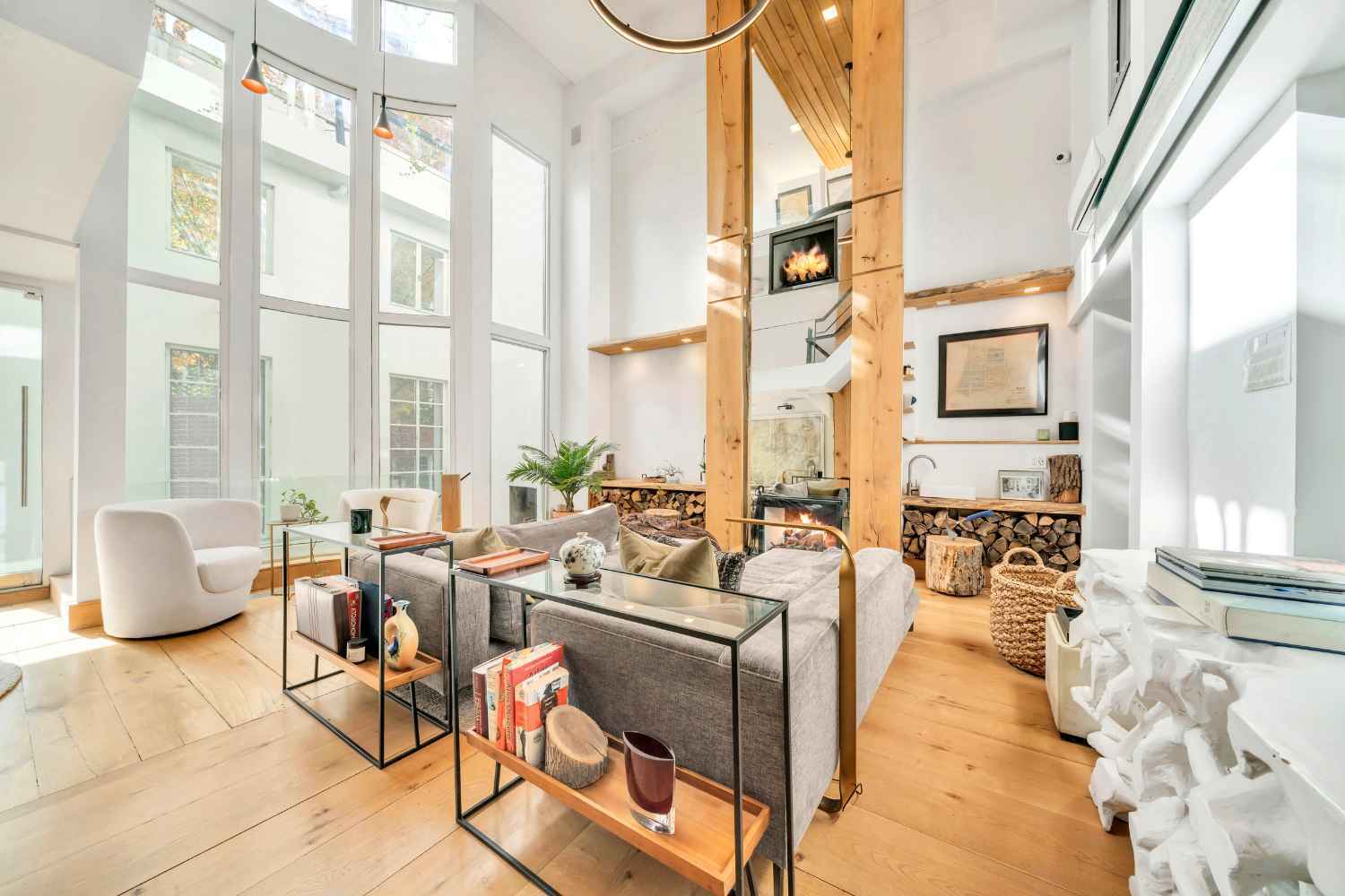 Undisclosed Address Manhattan, NY 10012 - Photo 1 of 36 a living room with furniture and floor to ceiling windows